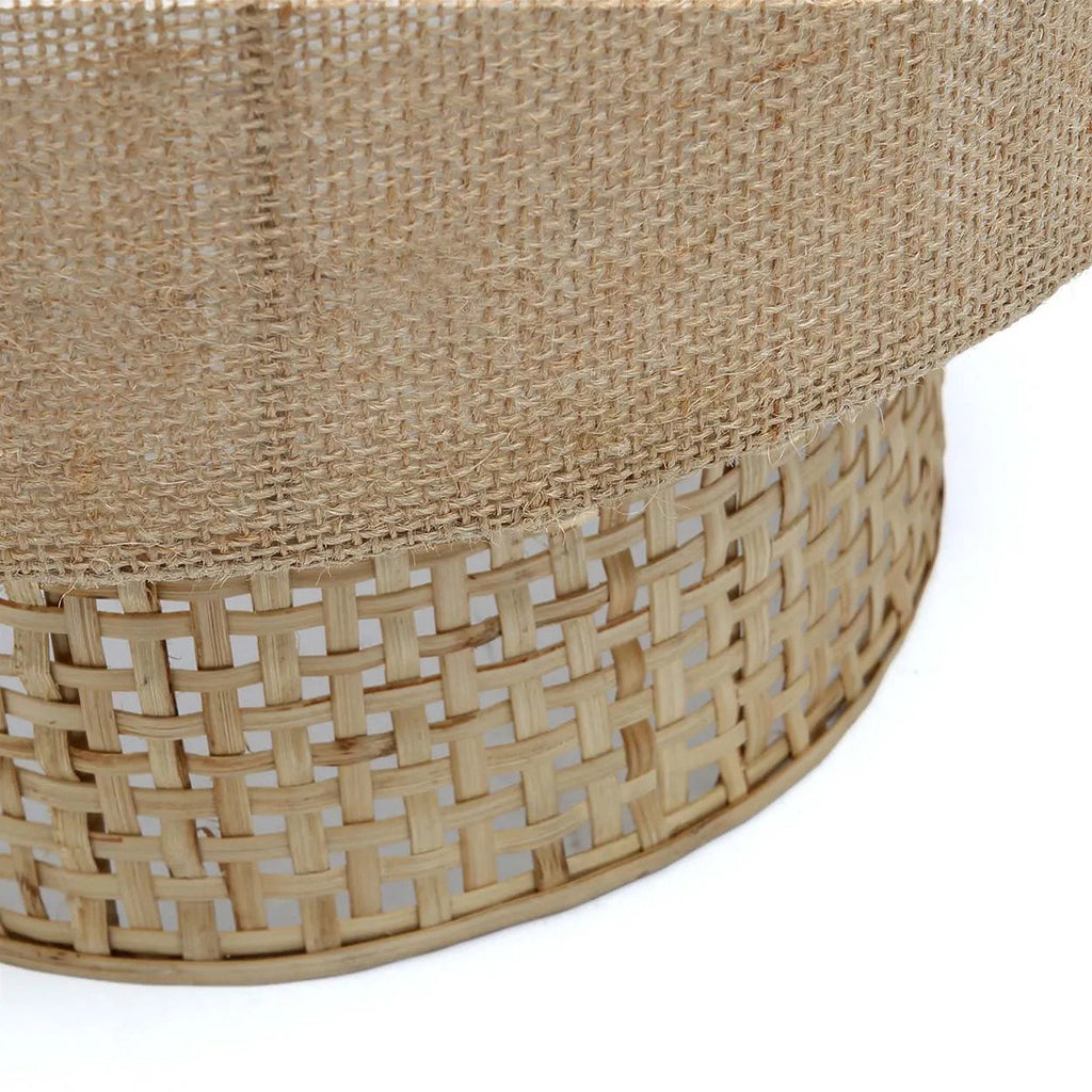 Woven rattan wall lamp on a white background
