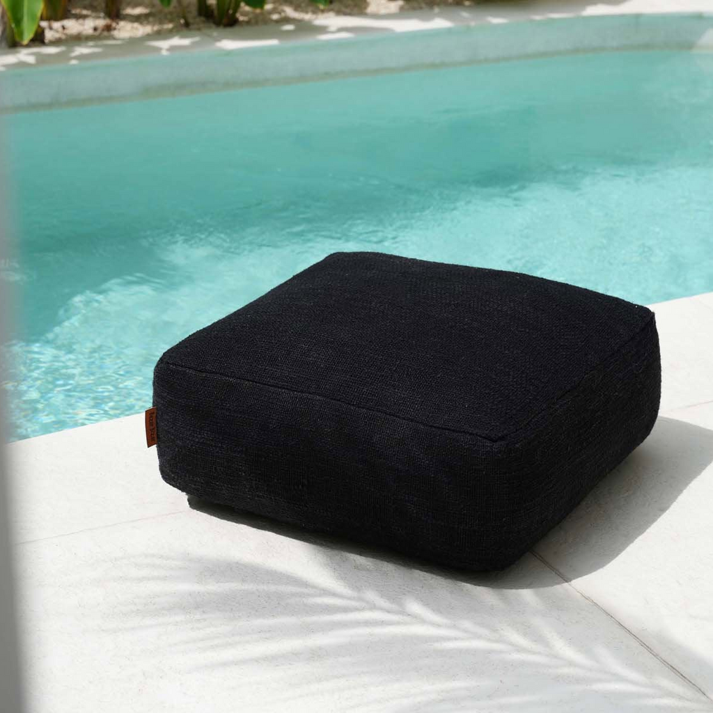 Black pouffe on a white background