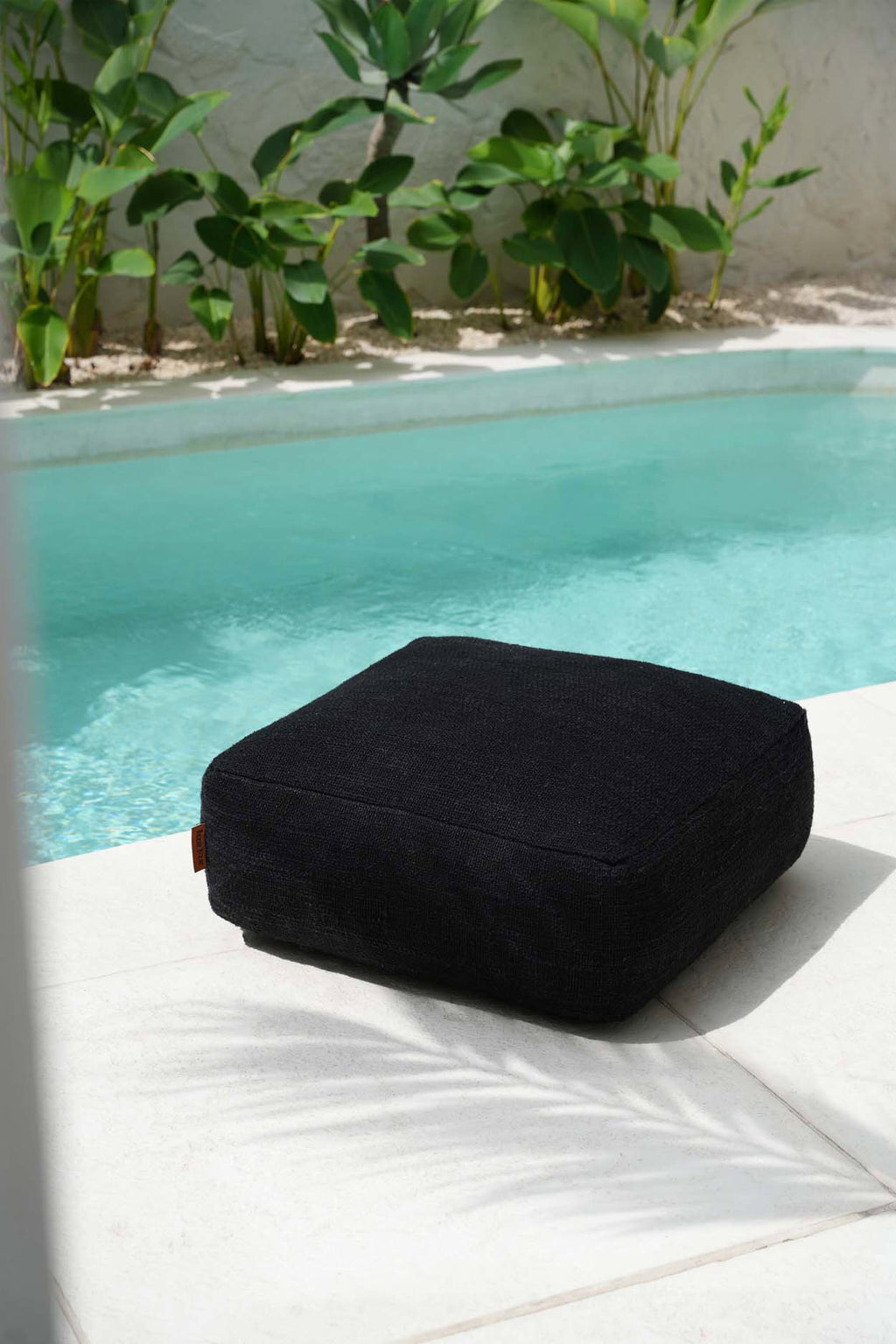 Black pouffe on a white background