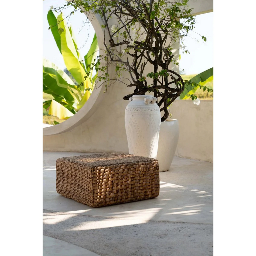 Woven pouffe on a white background